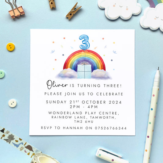 Personalised rainbow themed party invitations for a little boy's birthday party. The invites in the photo are for a 3rd birthday party.