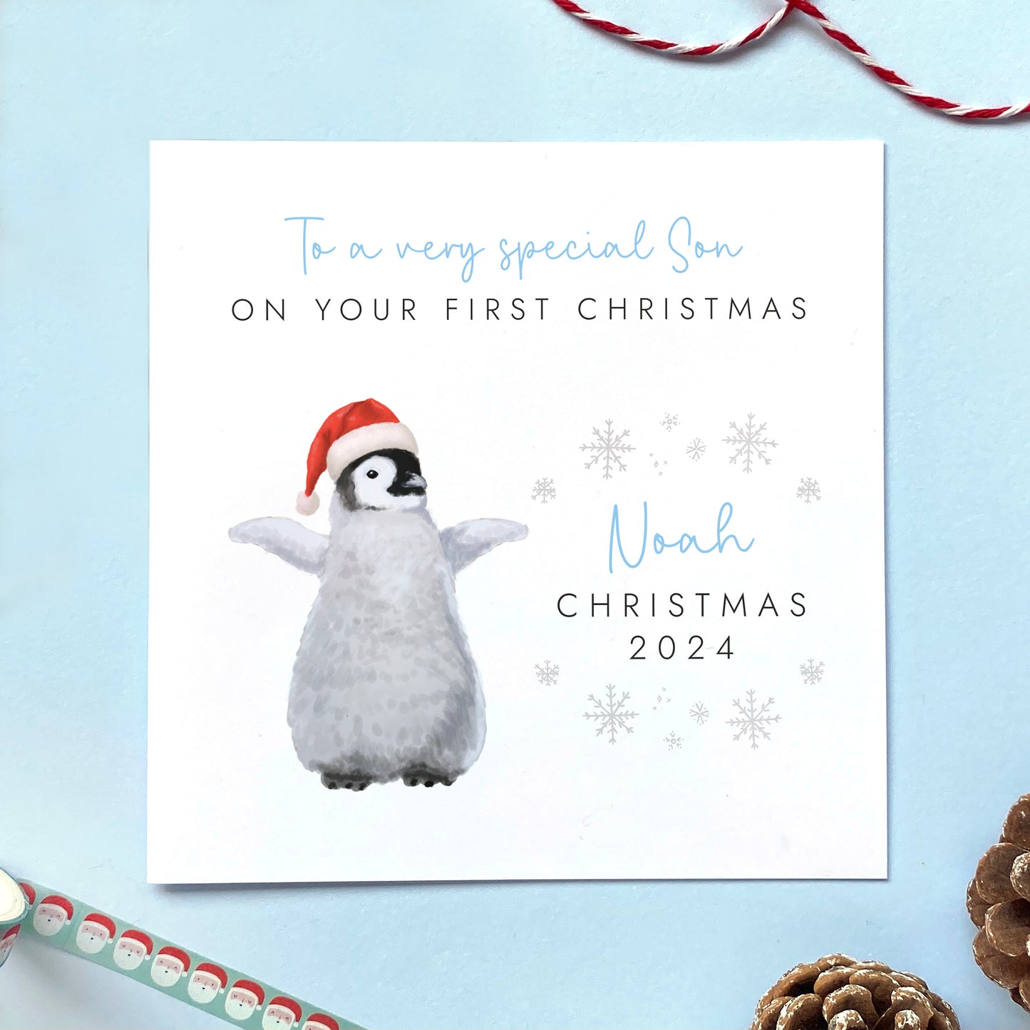 A personalised first Christmas card for boy. It features a baby penguin in a Santa hat, and is suitable for any baby boy born in 2024, for their 1st christmas. It is ideal for male relations such as Son, Grandson, Nephew, Brother and Godson. It can be personalised with his name above Christmas 2024.