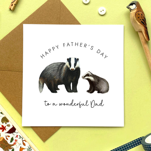A badger fathers day card featuring a british badger and baby. The wording reads 'Happy Father's Day to a wonderful Dad'.