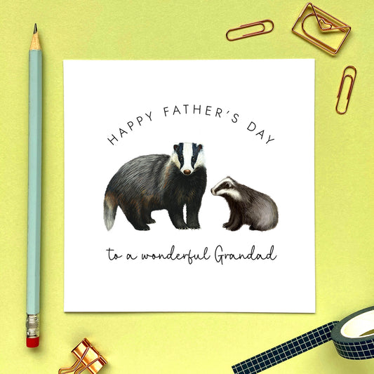 A badger fathers day card featuring a british badger and baby. The wording reads 'Happy Father's Day to a wonderful Grandad'.