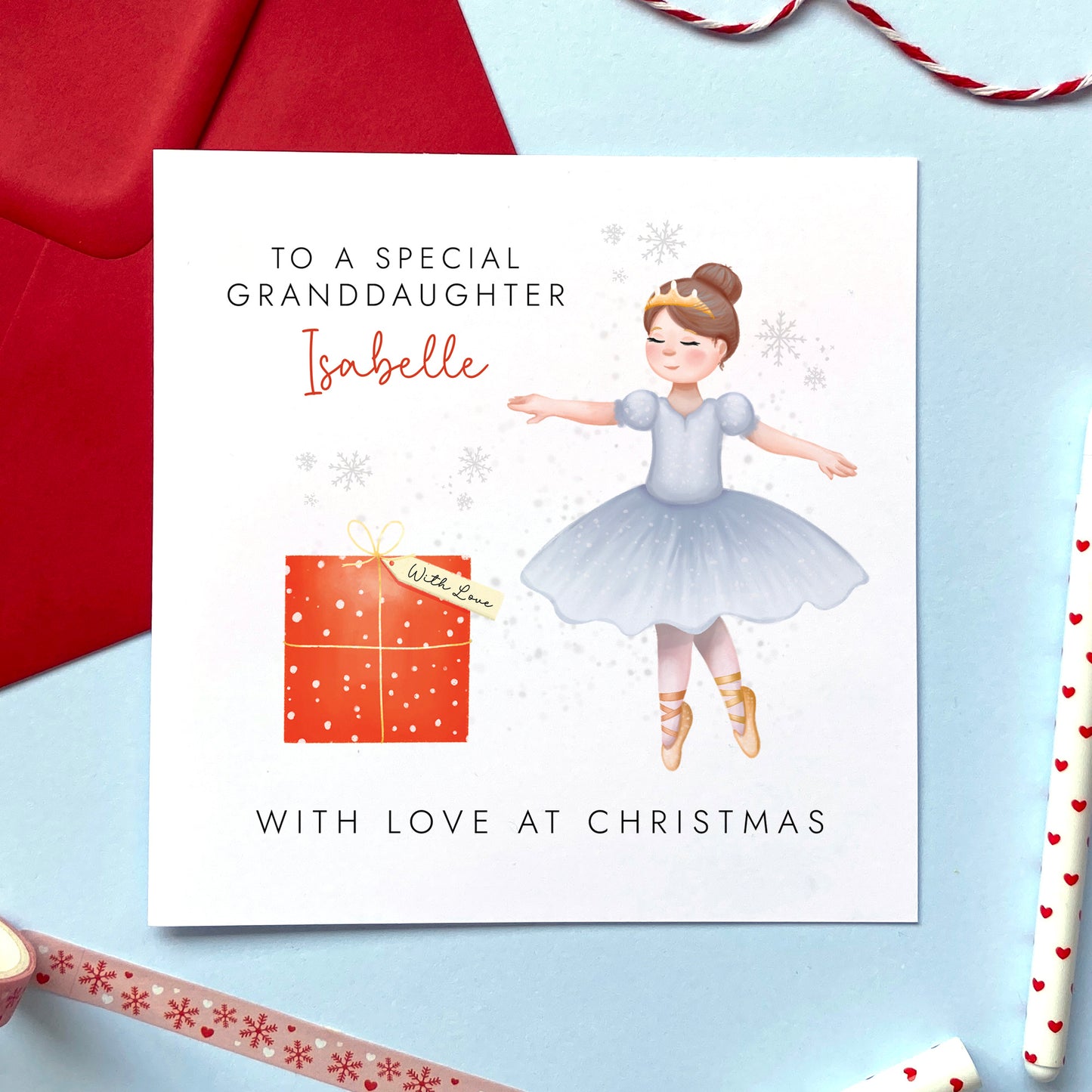 A personalised Christmas Card for Little Girls featuring a Ballerina. You can choose from a range of female relations such as Daughter, Granddaughter, Niece and Sister. It can be customised with a name. The card in the photo is a Christmas Card for Granddaughter.
