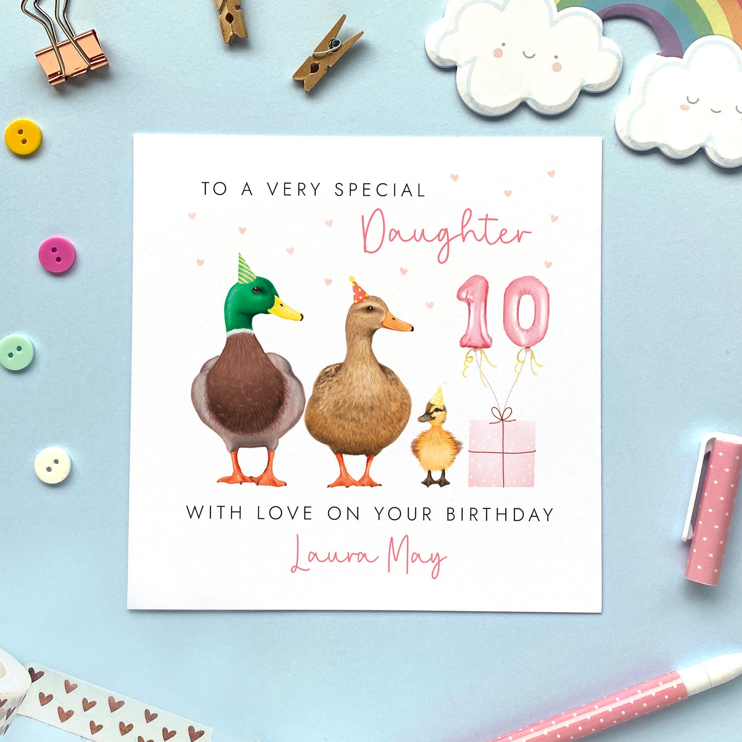 A cute personalised birthday card for Daughter featuring a pair of mallard ducks with their baby duckling. It's suitable for any age, including 1st, 2nd, 3rd, 4th, 5th, 6th, 7th, 8th, 9th and 10th. The relation can be changed to any female family member, like Granddaughter, Niece, and Goddaughter. The card in the photo is for 10th birthday.
