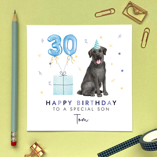 A personalised black labrador dog birthday card for Him. It can be personalised with any name and age. The card in the photo is a 30th birthday card for son.