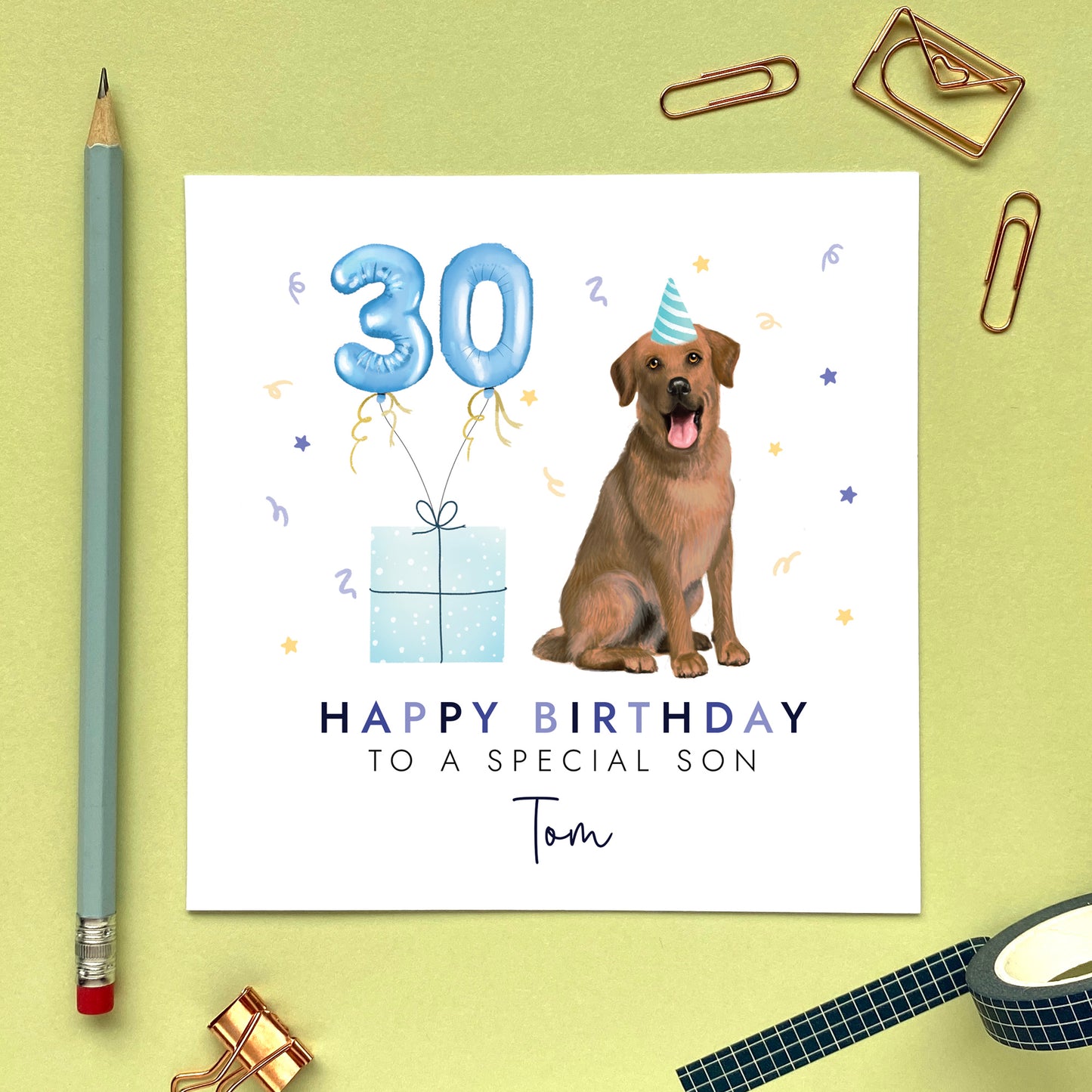 A personalised dog birthday card for him featuring a chocolate brown labrador. It can be personalised with any name and age. The card in the photo is a 30th birthday card for son.