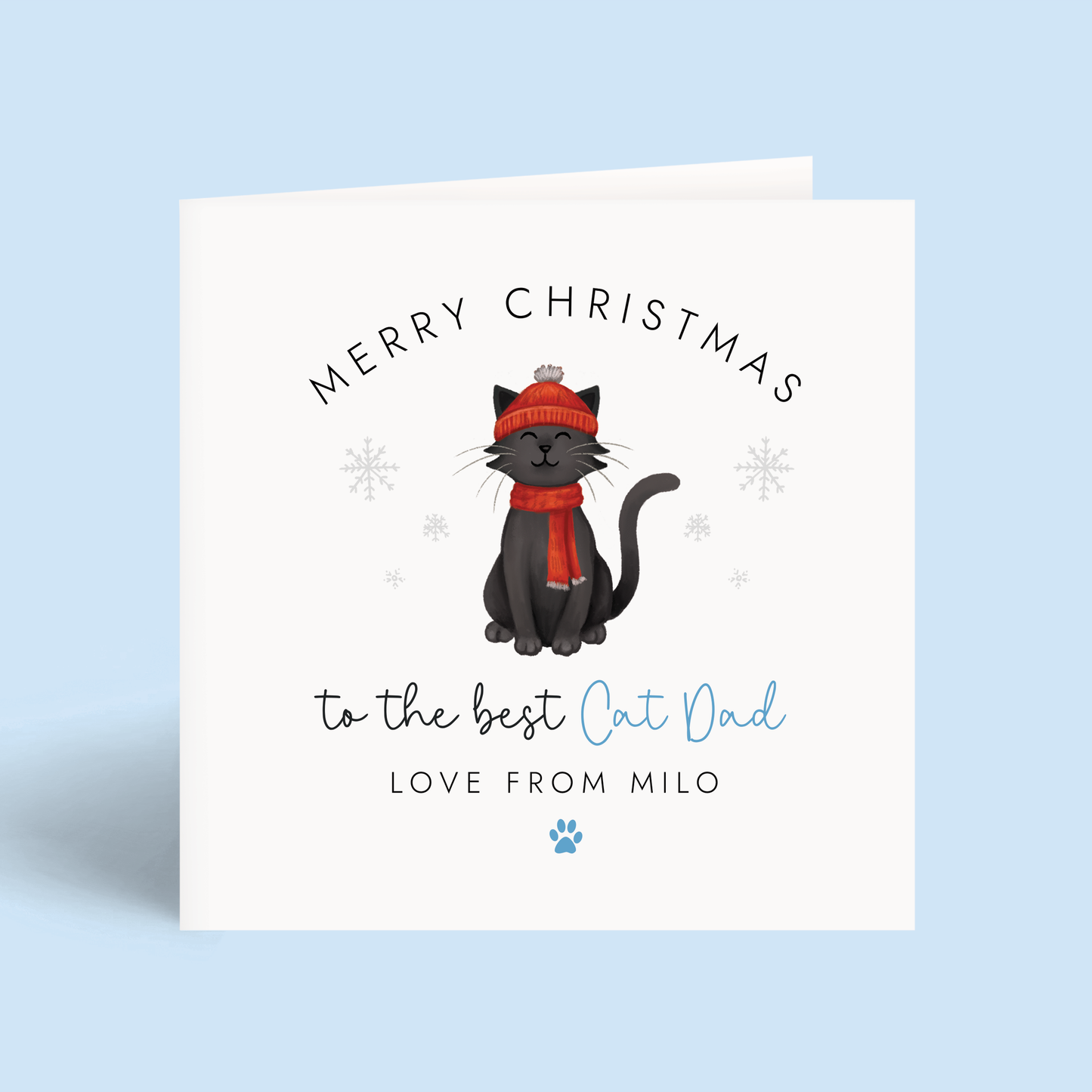 Personalised Cat Dad Christmas card with a black cat wearing a red hat and scarf on a light blue background.