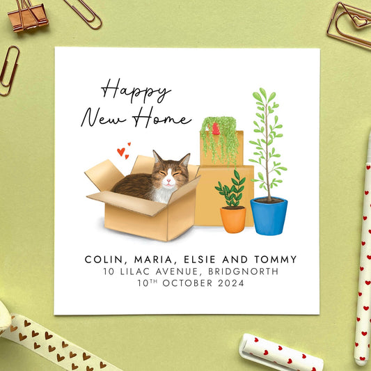 A personalised Happy New Home card featuring a brown tabby cat in a box.
