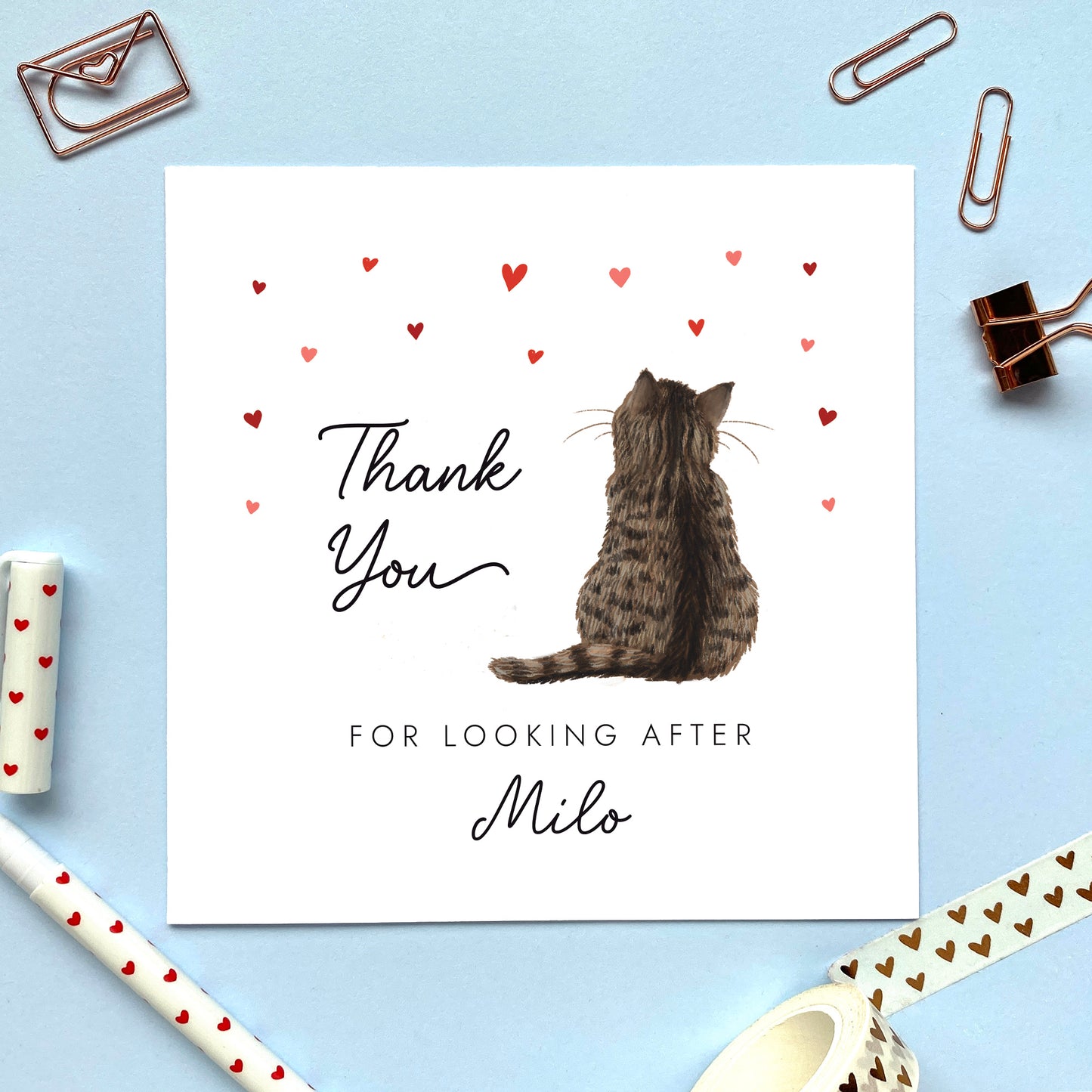 Personalised cat thank you card, the cat design can be chosen from a range of designs. The cat on the card photo is a brown tabby cat. The wording reads 'thank you for looking after Milo'.