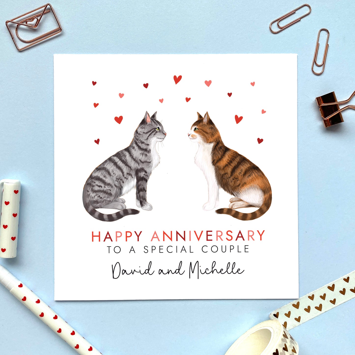 A personalised cats anniversary card for couple. You can choose both two cats on the card. Ideal for a range of relations, friends and family. The cats in the photo are a silver tabby cat and a calico cat.