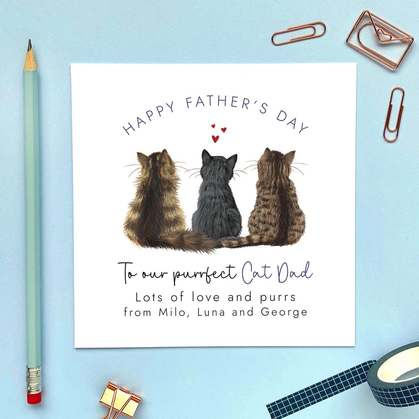 A personalised Father's Day card with illustrations of three cats and the text 'Happy Father's Day' along with a message signed by the cats to 'our purrfect Cat Dad'.