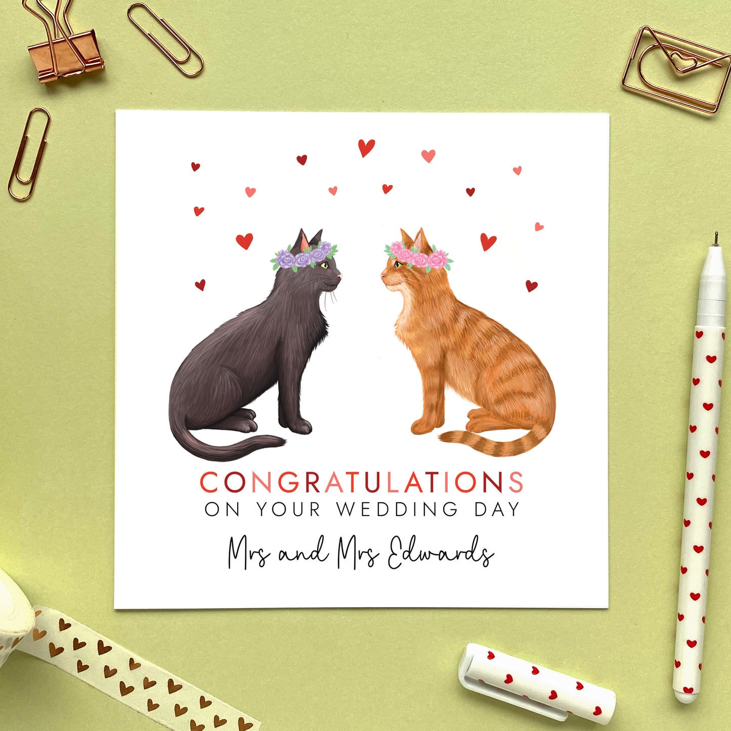 A personalised congratulations on your wedding day card for Mrs and Mrs. You can choose both cats on the card. It's ideal for any gay lesbian couple who are just married, such as daughter and daughter-in-law, granddaughter and wife, same sex couples and friends.