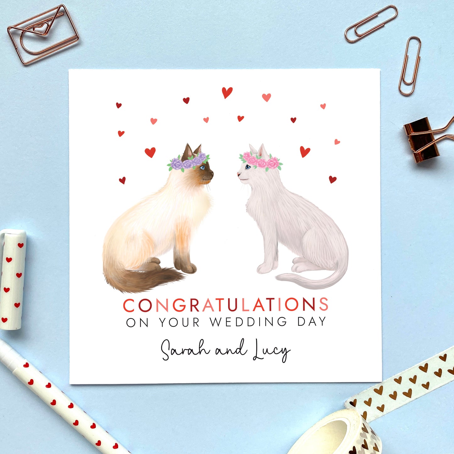 A personalised congratulations on your wedding day card for Mrs and Mrs. You can choose both cats on the card. It's ideal for any gay lesbian couple who are just married, such as daughter and daughter-in-law, granddaughter and wife, same sex couples and friends.