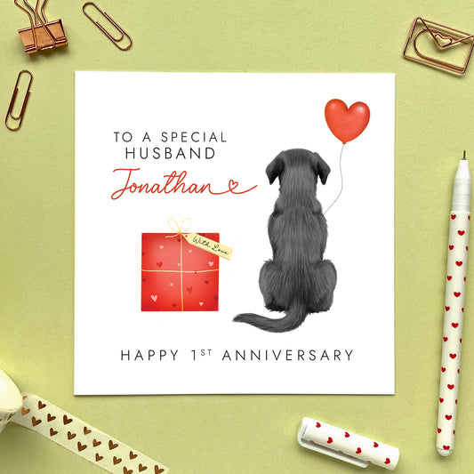 A personalised anniversary card for Husband featuring a Black Labrador Retriever. It can be personalised with a name and is suitable for both him and her. Ideal for husband, wife, fiancé, fiancée, boyfriend and girlfriend, for any anniversary such as 1st wedding anniversary.