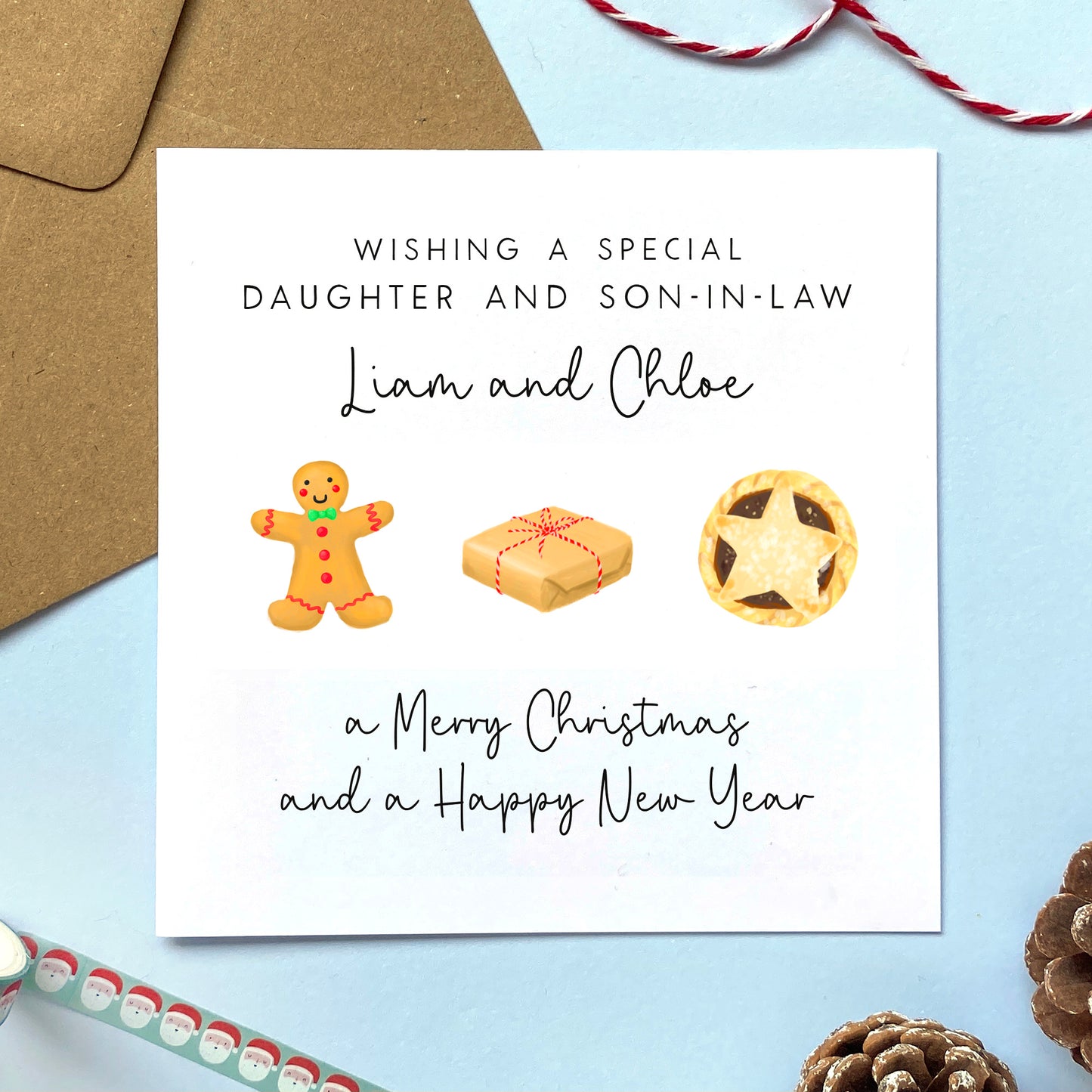 A personalised Christmas card featuring a gingerbread man, a brown parcel and a mince pie. It can be personalised with two names. The example card is for Daughter and Son in Law, but the relations can be changed for any family member.