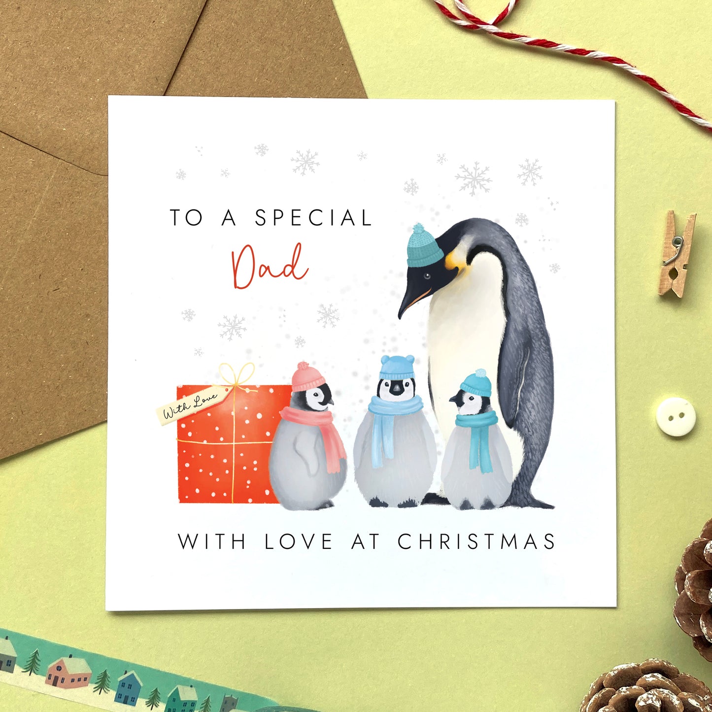 A Personalised Penguins Christmas Card for Dad from three children.