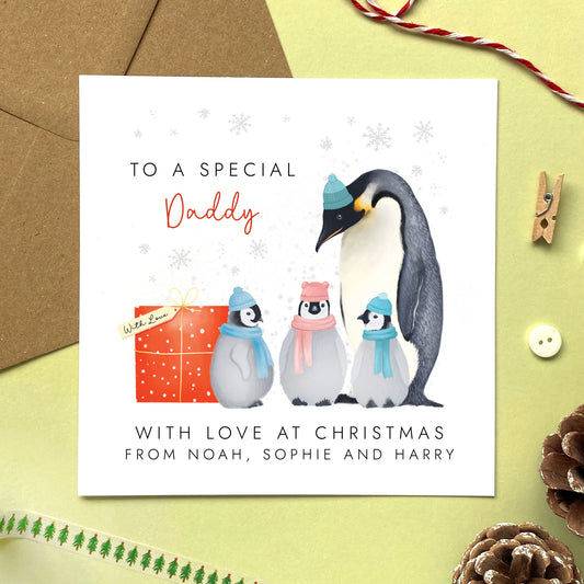 A Personalised Penguins Christmas Card for Daddy from three children.
