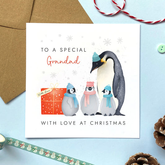 A Personalised Penguins Christmas Card for Grandad from three children.