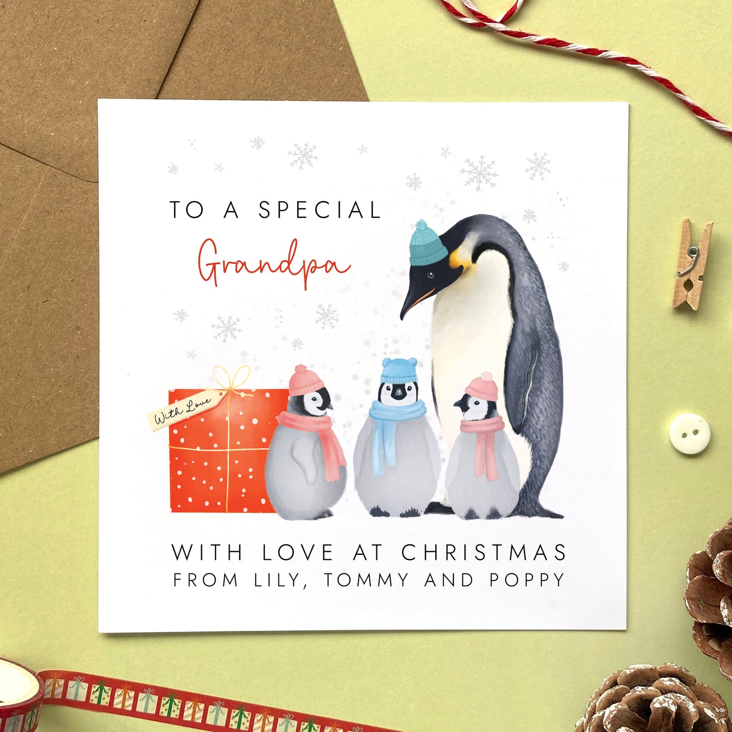 A Personalised Penguins Christmas Card for Grandpa from three children.