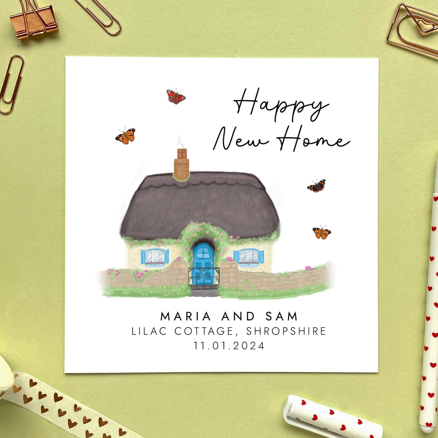A personalised New Home card featuring a country cottage with a thatched roof.