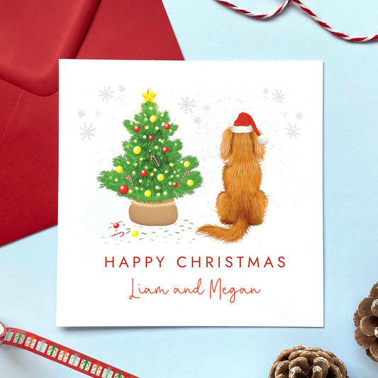 A personalised dog Christmas card featuring a ruby brown king charles spaniel.