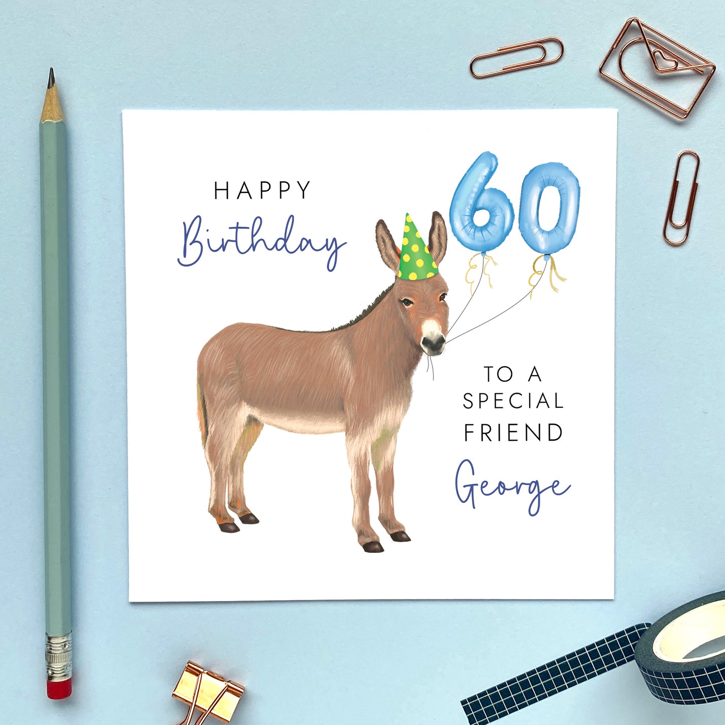 A personalised birthday card for him featuring a donkey with birthday balloons. It can be personalised with a name, relation and any age. The card in the photo is a 60th birthday card for Friend.