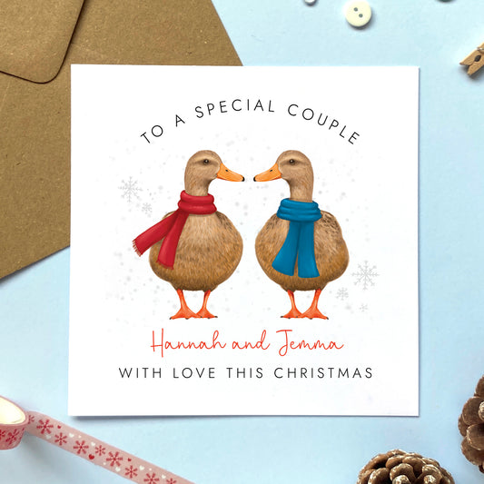 A personalised duck Christmas card for a special Couple. It can be personalised with the couple's names. It features a pair of mallard ducks both female for two women, or a lesbian couple.