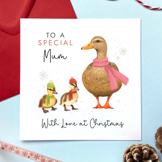 A personalised ducks christmas card for Mum. It features a female mallard duck next to two baby ducklings or children with the text 'To a special Mum, with love at Christmas'.