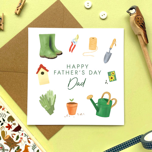 A gardening themed fathers day card for Dad featuring a range of garden tools such as a pair of green wellies, a watering can, gloves, seeds, bird house and trowel.