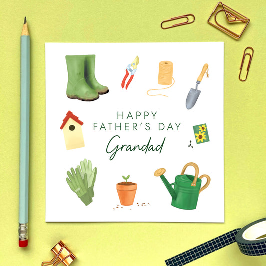 A gardening themed fathers day card for Grandad featuring a range of garden tools such as a pair of green wellies, a watering can, gloves, seeds, bird house and trowel.