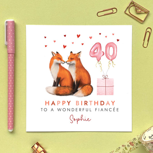 A personalised birthday card for her featuring a fox couple. It can be personalised with any relation, age and name. The card in the photo is a 40th birthday card for Fiancée.