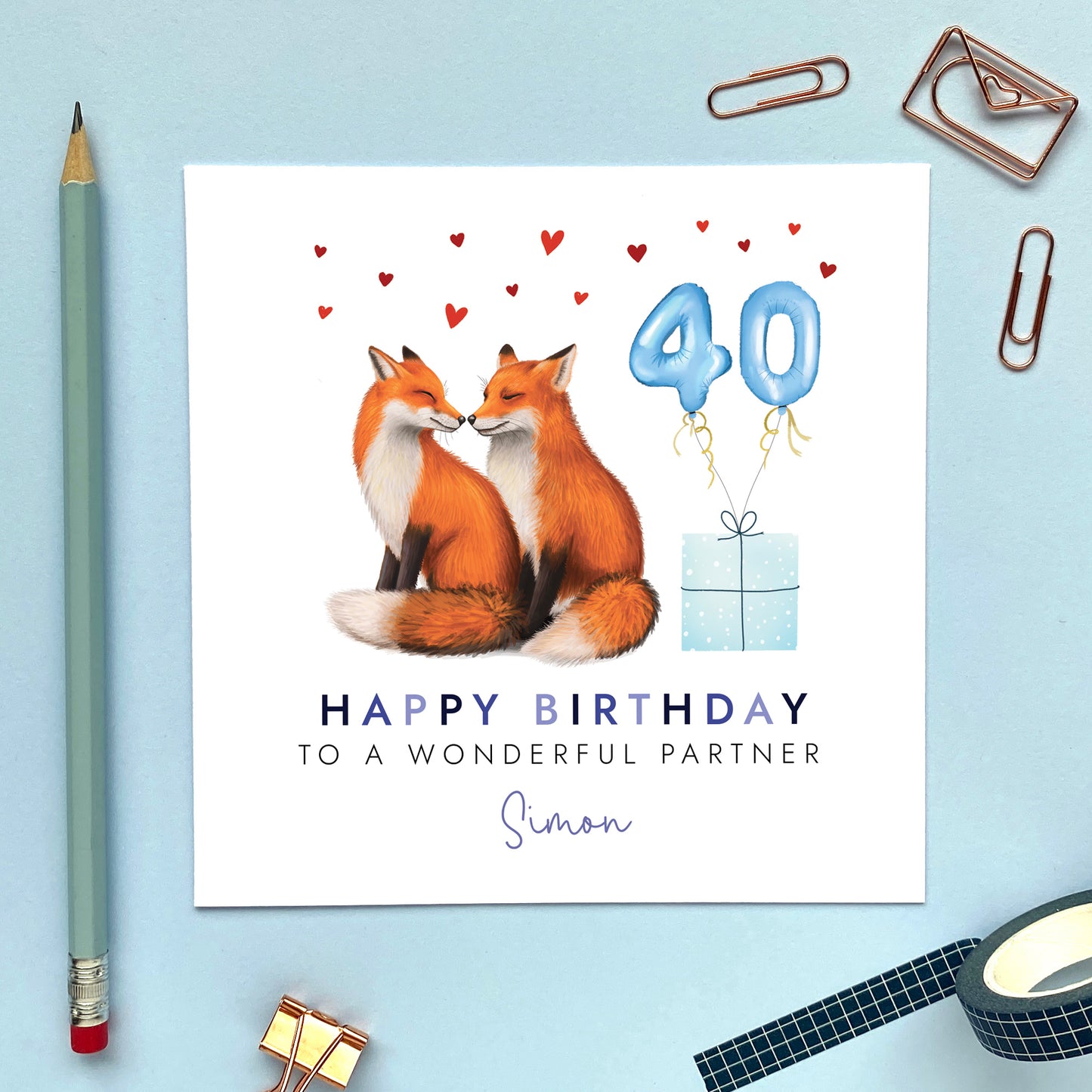 A personalised birthday card for him featuring a fox couple. It can be personalised with any relation, age and name. The card in the photo is a 40th birthday card for Partner.