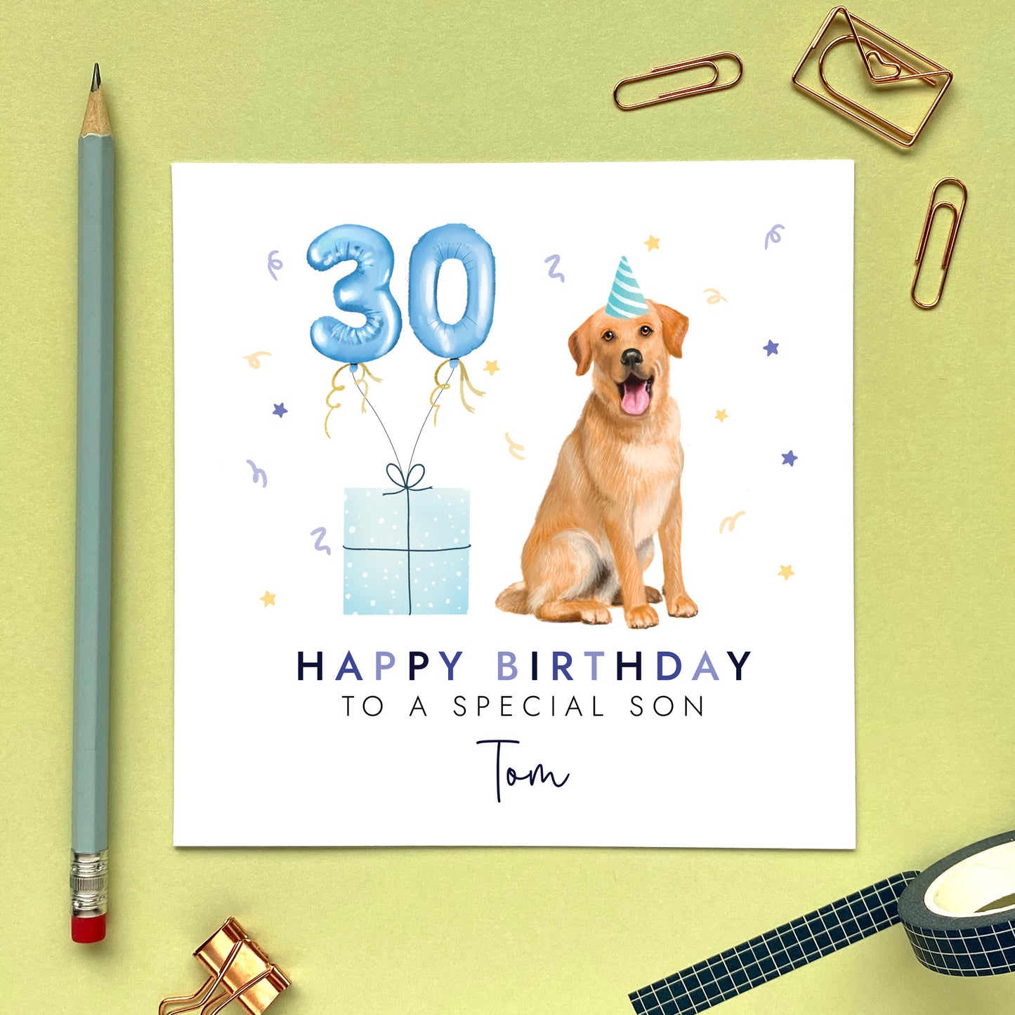 A personalised dog birthday card for him featuring a golden labrador. It can be personalised with any name and age. The card in the photo is a 30th birthday card for son.