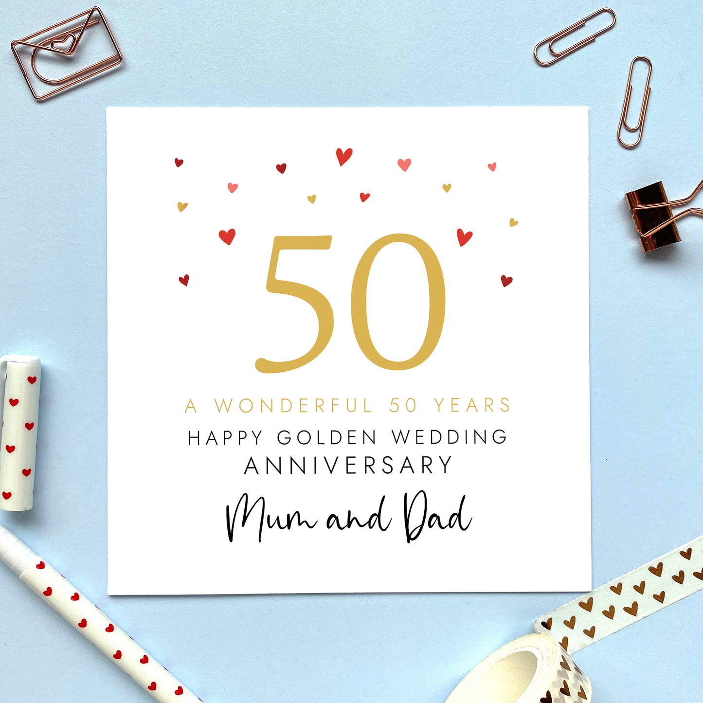 A personalised 50th wedding anniversary card for parents. It features the number 50 in gold with hearts, the colour scheme matches the theme of golden. The text reads 'A wonderful 50 years, Happy Golden Wedding Anniversary Mum and Dad'. The relations can be changed to any.