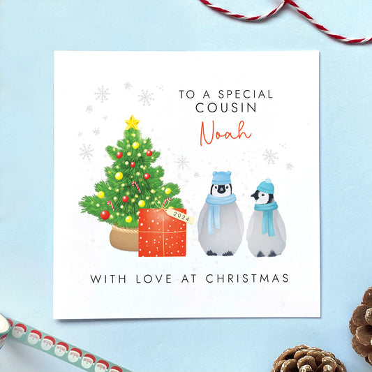A personalised penguins Christmas Card for male Cousin.