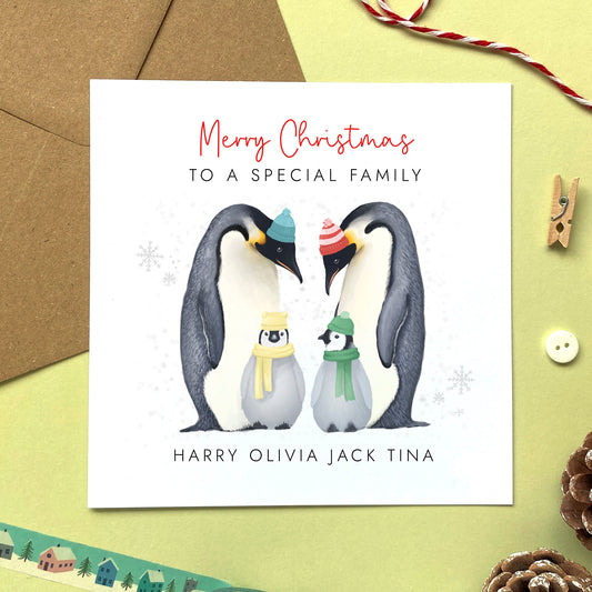 A personalised penguins Christmas Card for family with two children.