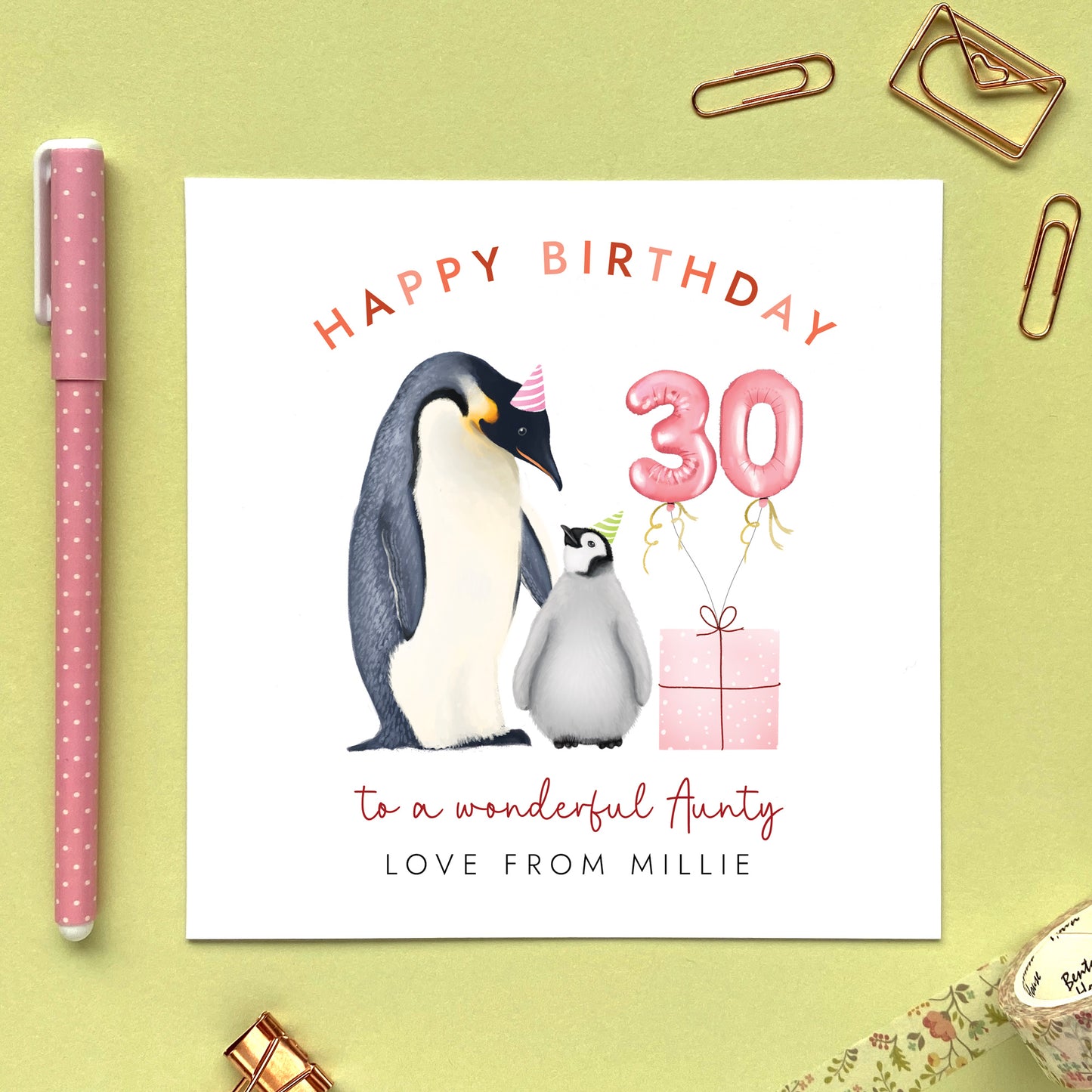 A personalised penguins 30th birthday card for Aunty, featuring an adult penguin standing next to a baby penguin, a pink present with pink 30 balloons. It can be personalised with the child's name from a niece or nephew.