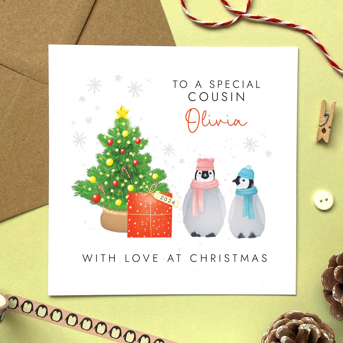 A personalised penguins Christmas Card for male or female Cousin.