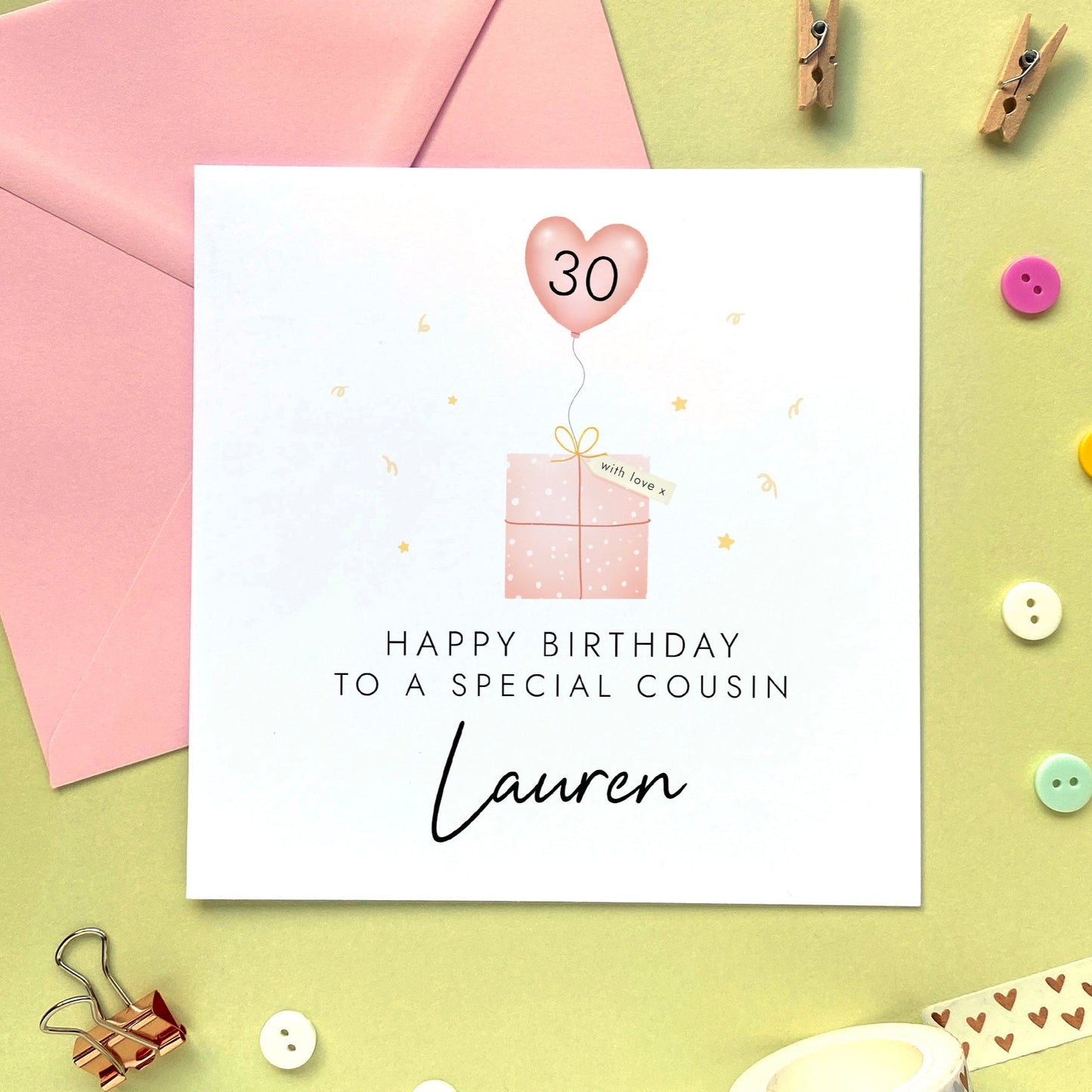 A cute personalised birthday card for Cousin featuring a pink present and heart shaped balloon. It can be personalised with any name and age, including 16th, 18th, 30th and 40th. This card is suitable for any female Cousin. The card in the photo is for 30th birthday.