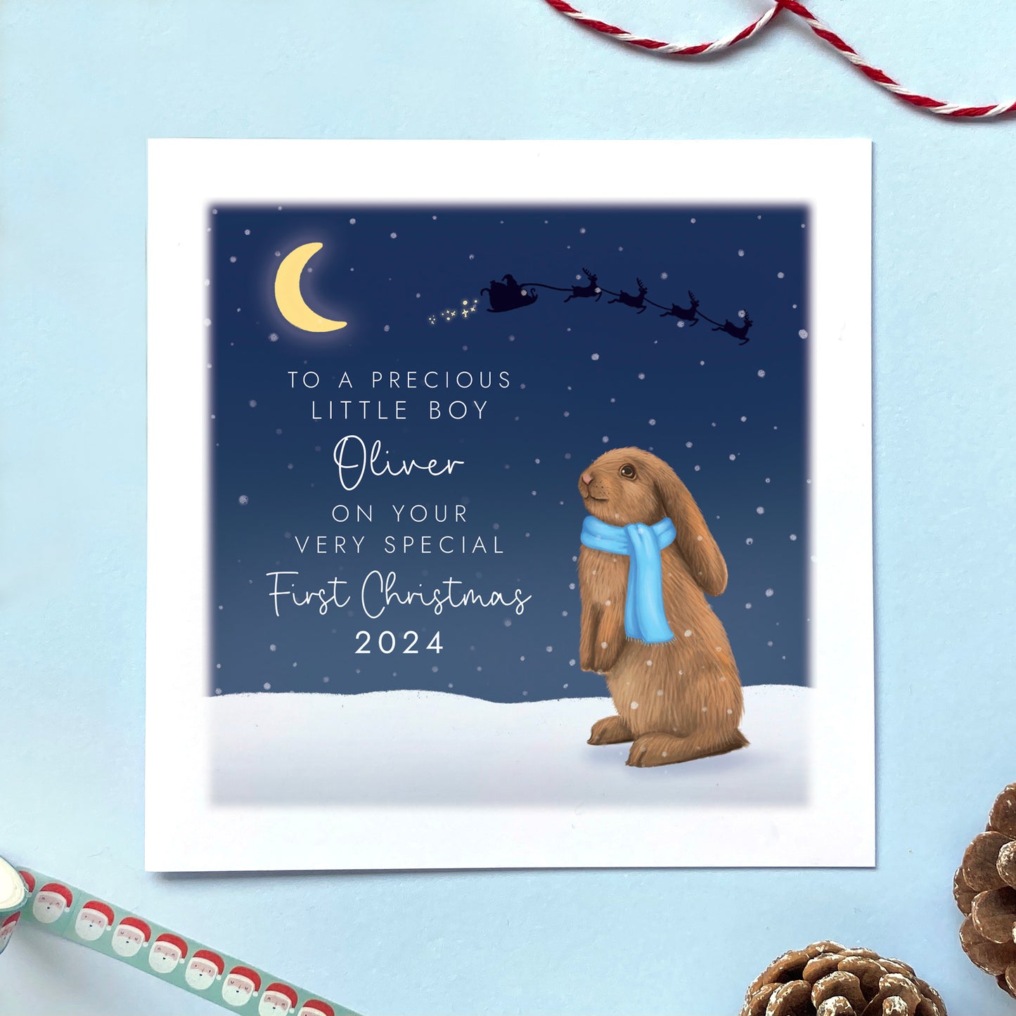A personalised Rabbit 1st Christmas Card for Baby's First Christmas. The card in the photo is a first Christmas card for Little Boy.