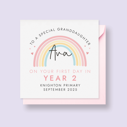 Personalised pink pastel rainbow card for starting a new school term. Add any girl's name, school name and starting date. The card in the photo is a first day in year 2 card for granddaughter.