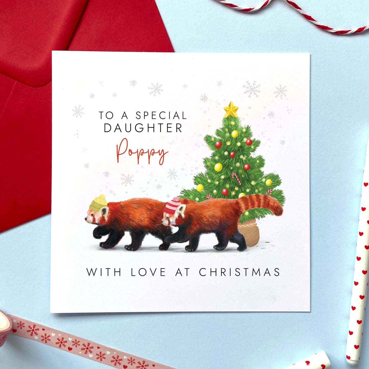 A personalised Christmas Card for Daughter featuring two red pandas and a Christmas tree.