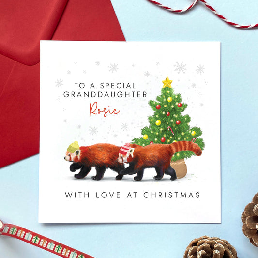 A personalised Christmas Card for Granddaughter featuring two red pandas and a Christmas tree.