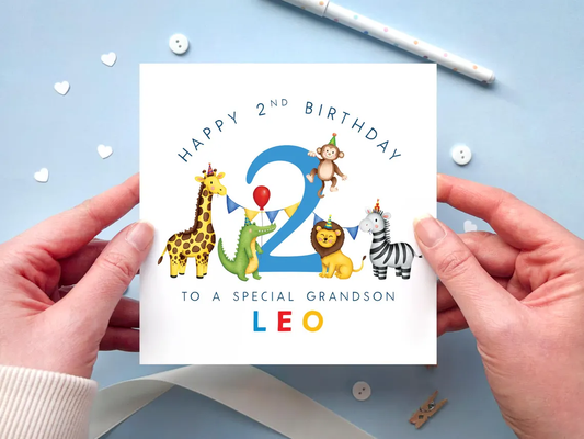 a personalised safari themed birthday card for boys, featuring illustrations of jungle animals - giraffe, crocodile, lion, zebra and monkey - around the number 2, in bright and bold colours