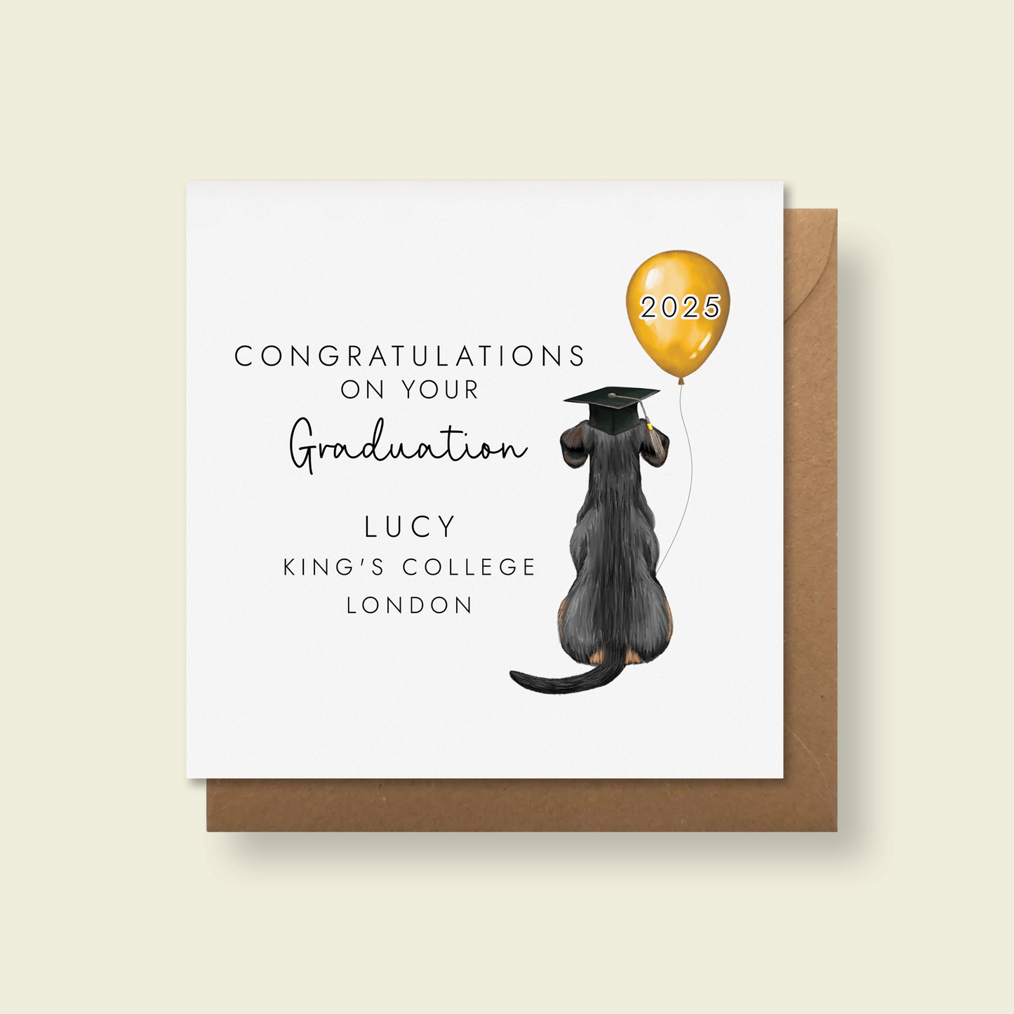 Personalised dog graduation card where you can choose from over 60 dog breeds and colours as well as a name and university. The card in the photo has a black and tan dachshund.