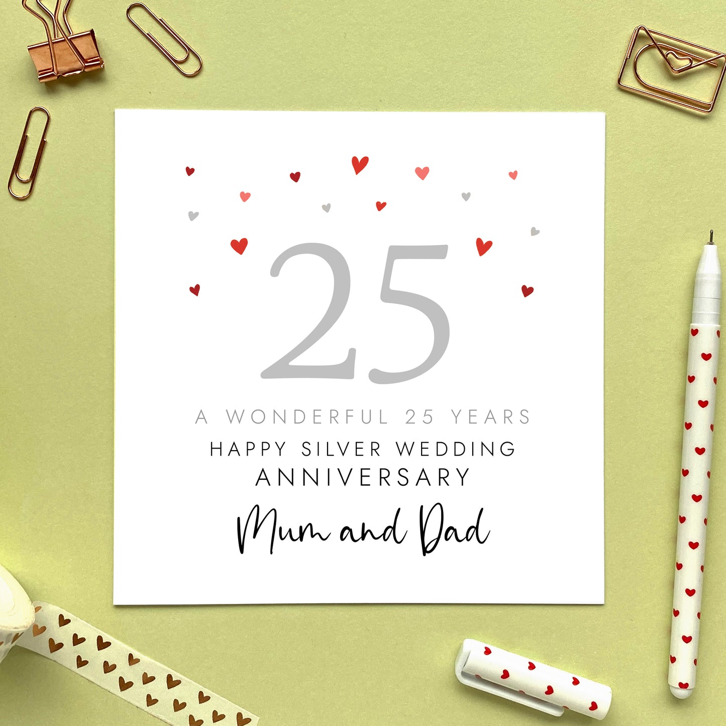 A personalised 25th wedding anniversary card for parents. It features the number 25 in silver with hearts, the colour scheme matches the theme of silver. The text reads 'A wonderful 25 years, Happy Silver Wedding Anniversary Mum and Dad'. The relations can be changed.