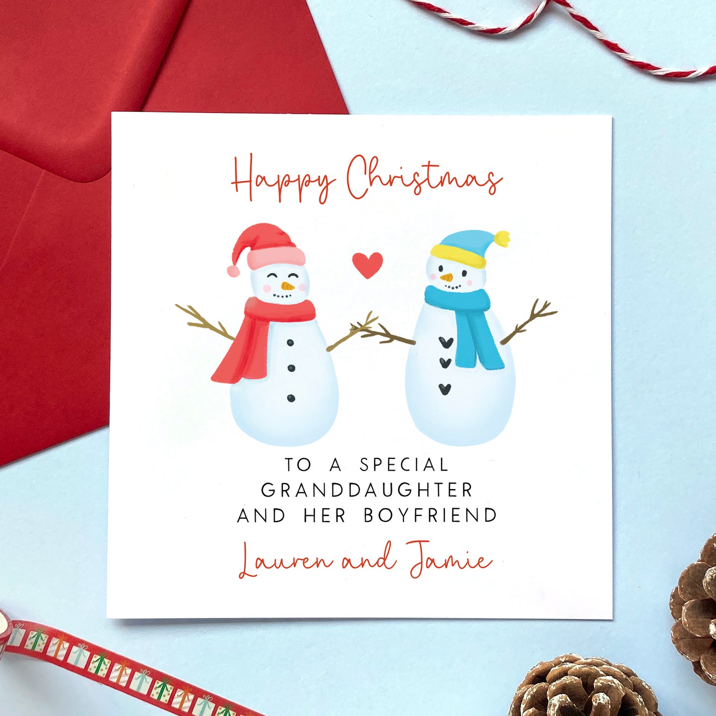 A personalised snowman couple Christmas card for a special Granddaughter and her Boyfriend.