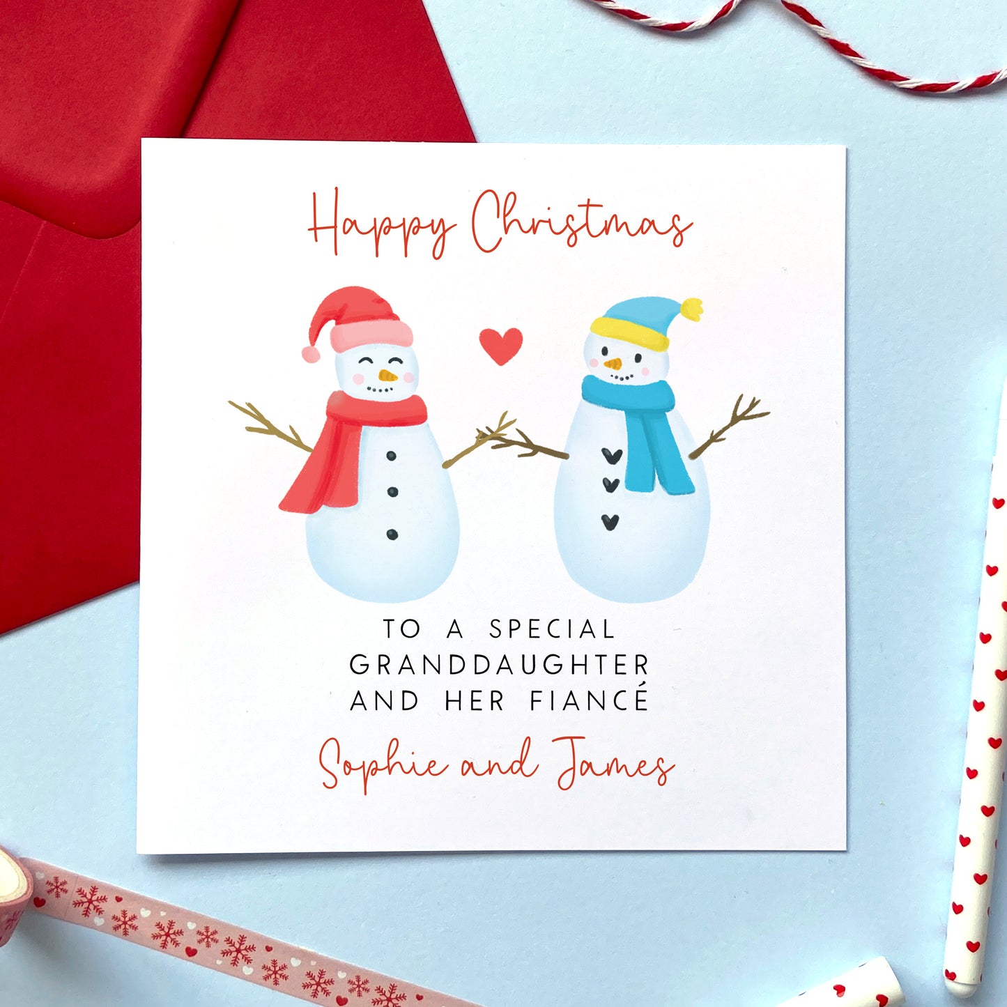 A personalised snowman couple Christmas card for a special Granddaughter and her Fiancé.