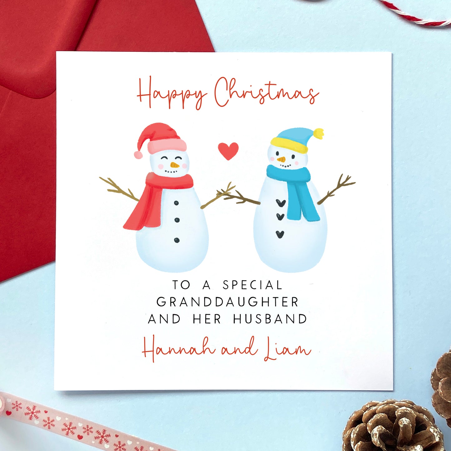 A personalised snowman couple Christmas card for a special Granddaughter and her Husband.