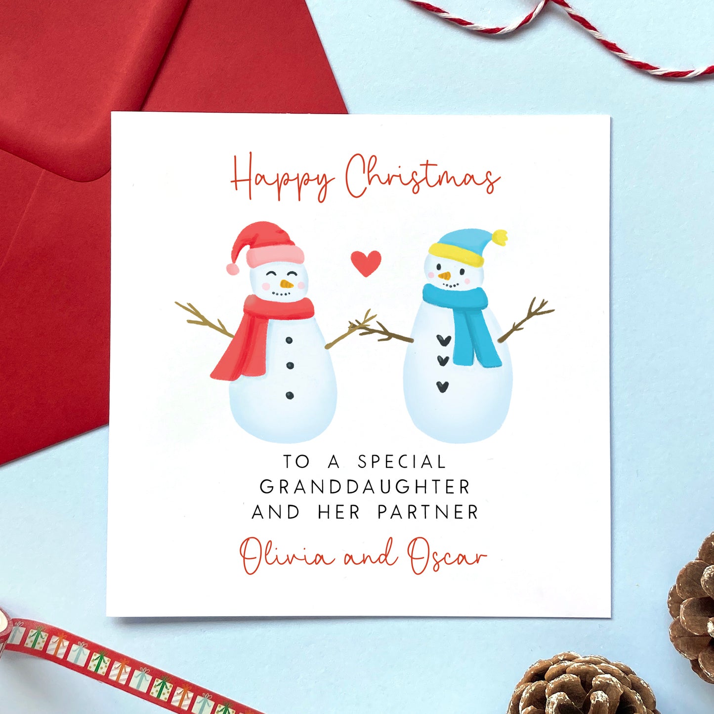 A personalised snowman couple Christmas card for a special Granddaughter and her Partner.