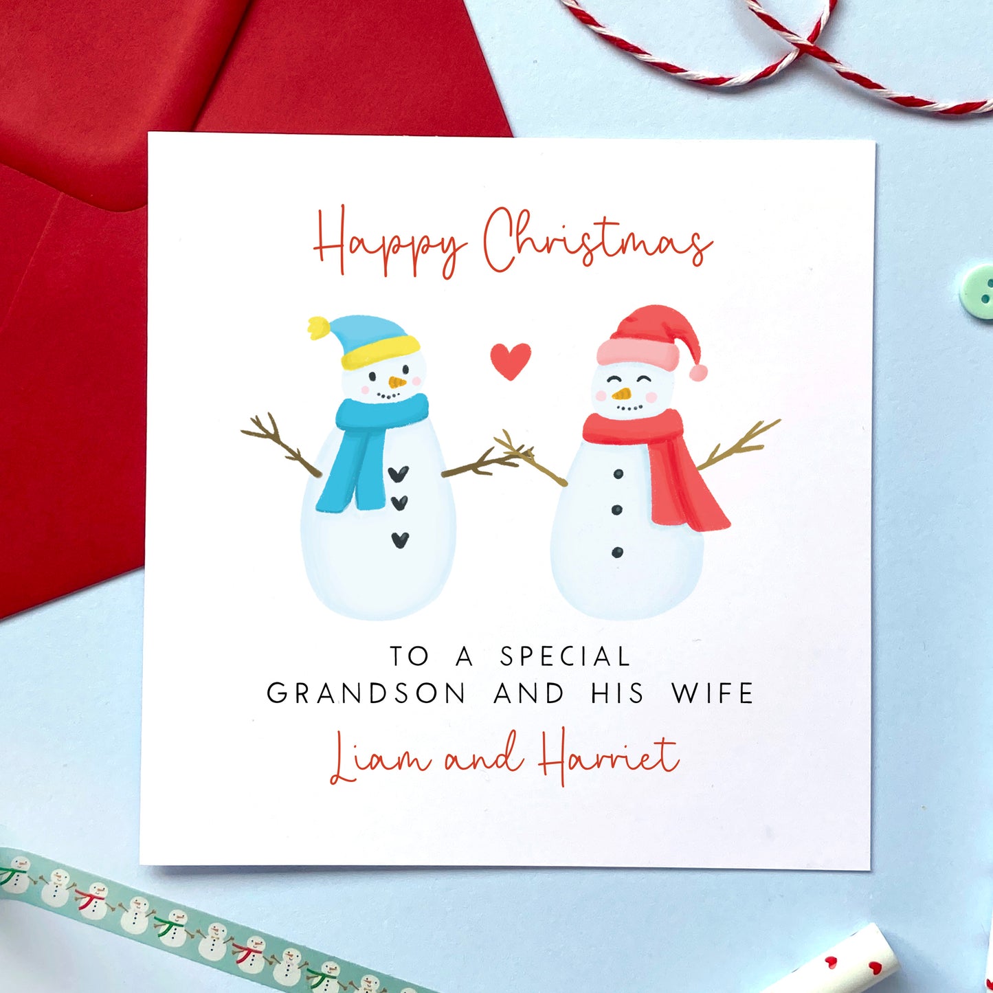 A personalised snowman couple Christmas card for a special Grandson and his Wife.