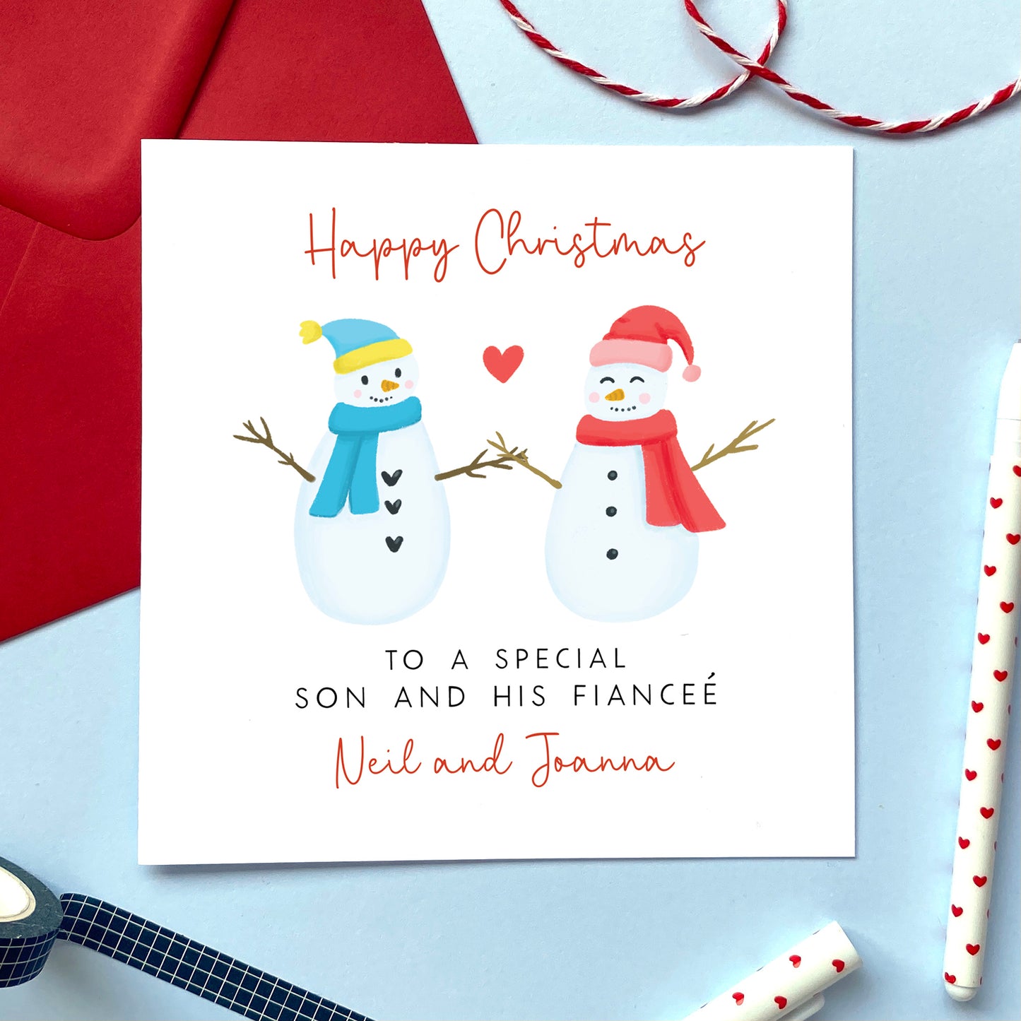 A personalised snowman couple Christmas card for Son and his Fiancée.